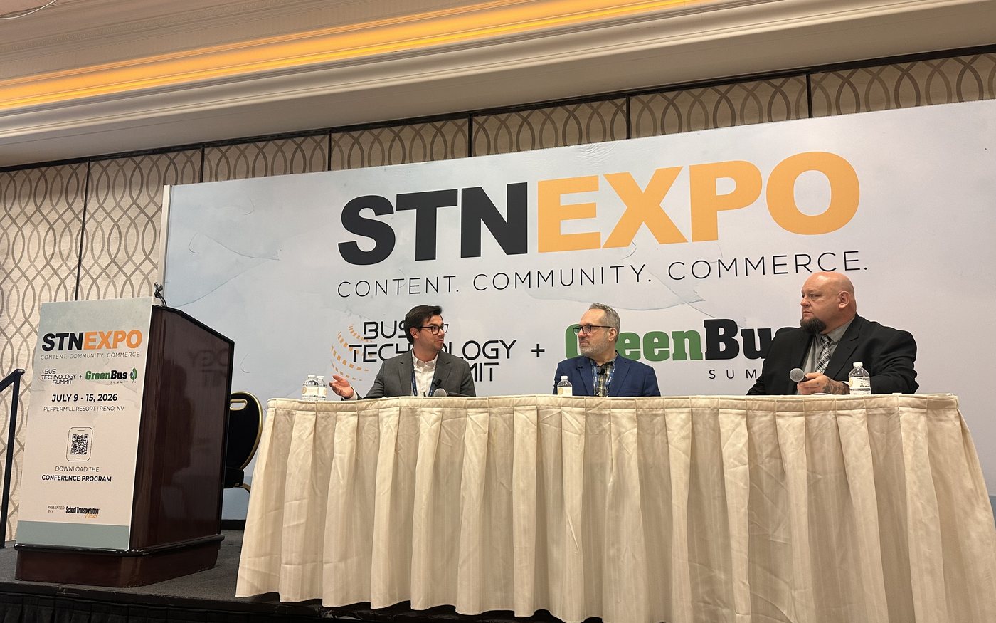 Grant Jones, Rudi Halbright, and Ernest Epley seated at a panel table on stage at STN Expo West in Reno, Nevada, in front of an STN Expo banner